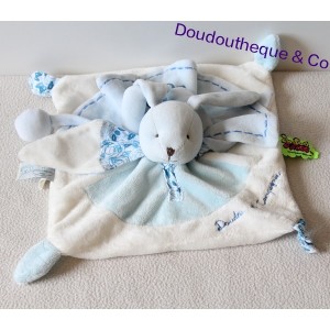 Doudou conejo tatuaje frazada y plato azul flor blanca de la empresa